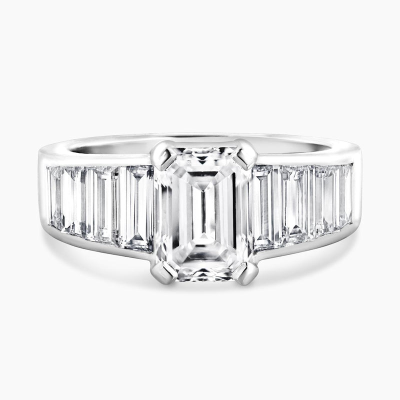 18ct White gold emerald cut diamond engagement ring with baguette cut diamonds on the band