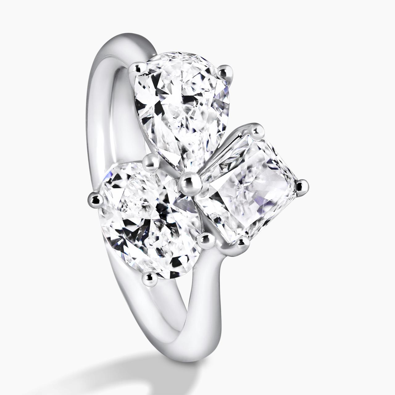 18ct white gold oval, pear and radiant diamond engagement ring side view
