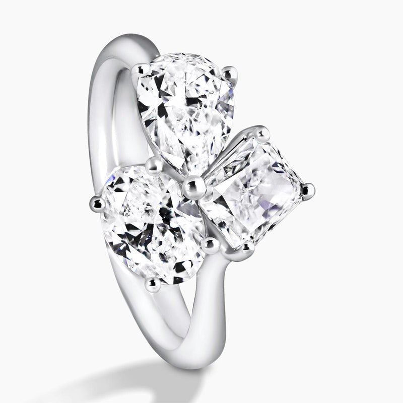 18ct white gold oval, pear and radiant diamond engagement ring side view