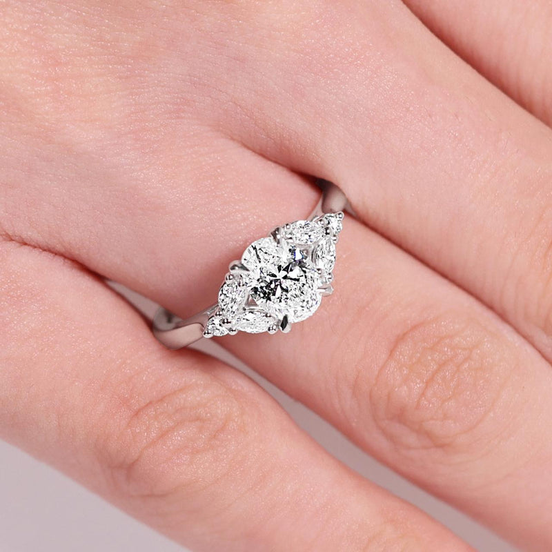 18ct white gold oval brilliant cut diamond engagement ring on the finger