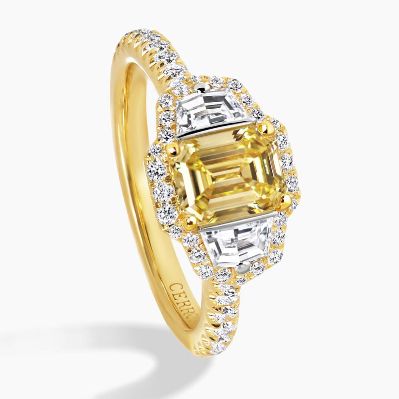 18ct yellow gold Fancy Intense Yellow emerald cut diamond engagement ring with cadillac step cut diamonds on the side