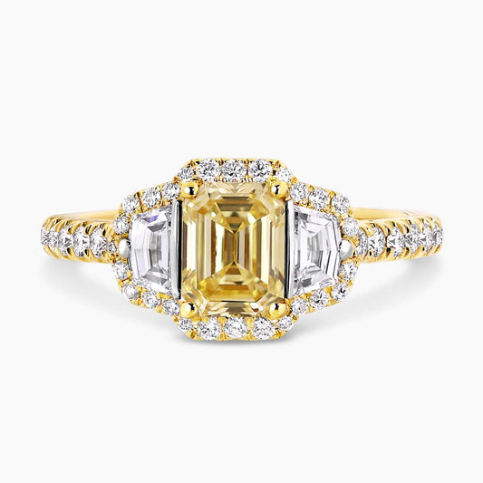 18ct yellow gold Fancy Intense Yellow emerald cut diamond engagement ring with cadillac step cut diamonds on the side