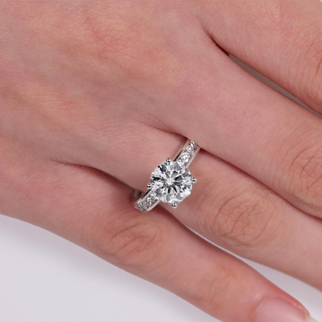 18ct white gold round brilliant cut LAB Grown diamond engagement ring on the finger