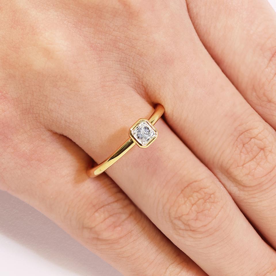 18ct yellow gold 0.42ct EF VS Asscher cut diamond in a bezel set ring