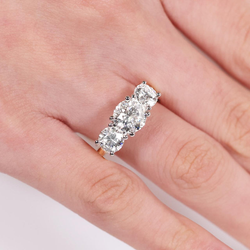 18ct yellow and white gold round brilliant cut LAB Grown Diamonds Engagement Ring on the finger