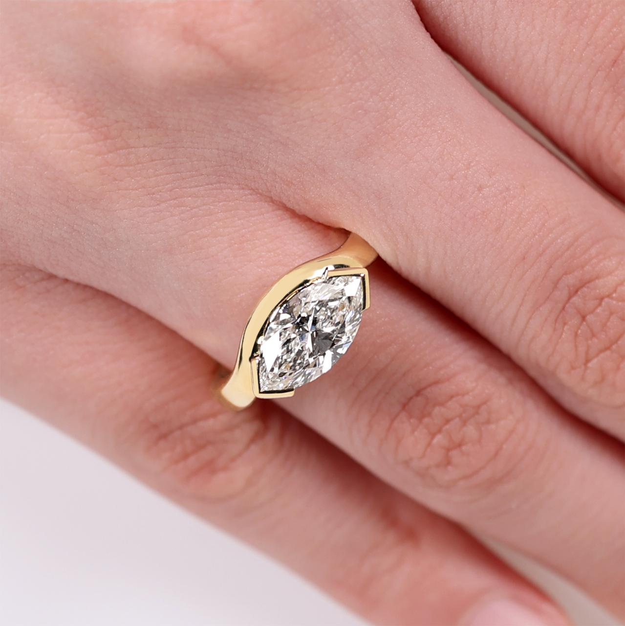 18ct yellow gold 2.07ct D VVS2 marquise lab grown diamond ring in a four claw setting. IGI Cert
