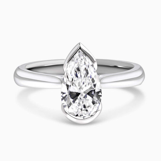 Platinum gold pear shaped lab grown diamond solitaire engagement ring in a half bezel setting