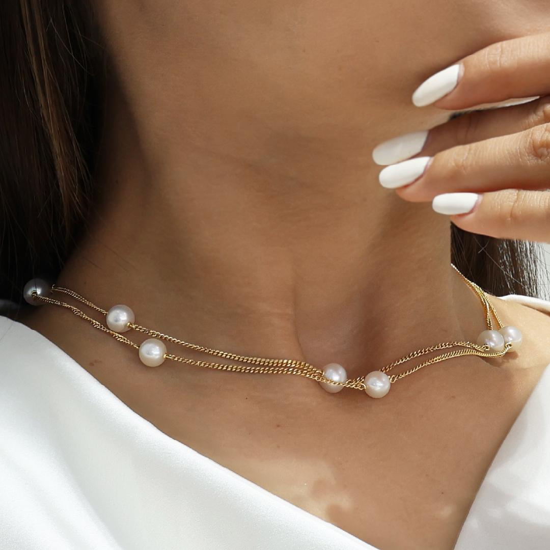 18ct yellow gold fresh water pearl necklace on the neck