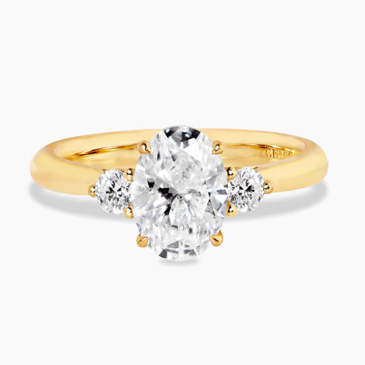18ct yellow gold 1.60ct and 2=0.10ct oval lab grown diamonds three stone ring