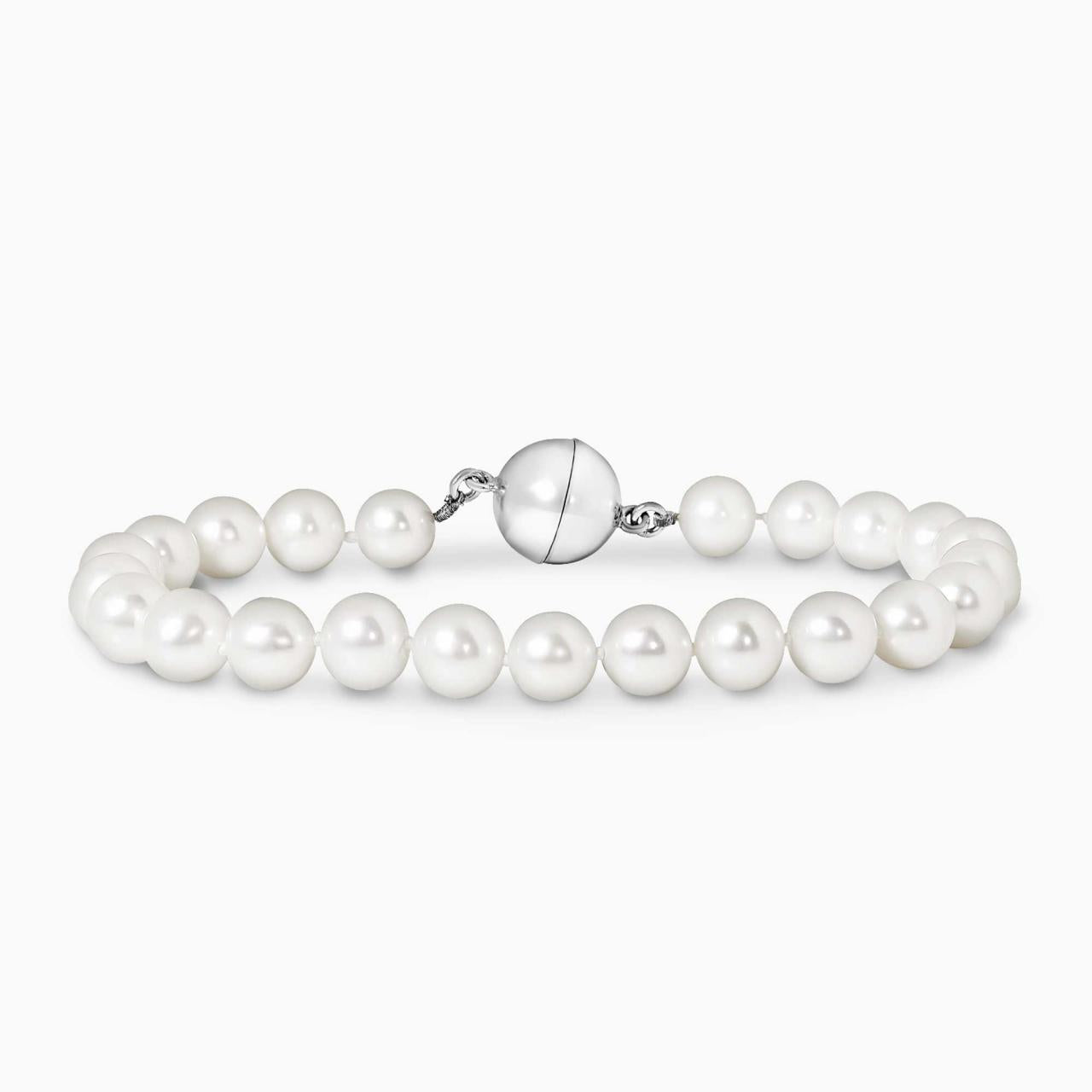 Fresh water 8mm pearls bracelet ended with a silver magnetic ball clasp from the Carmela Cerrone Collection on a white background