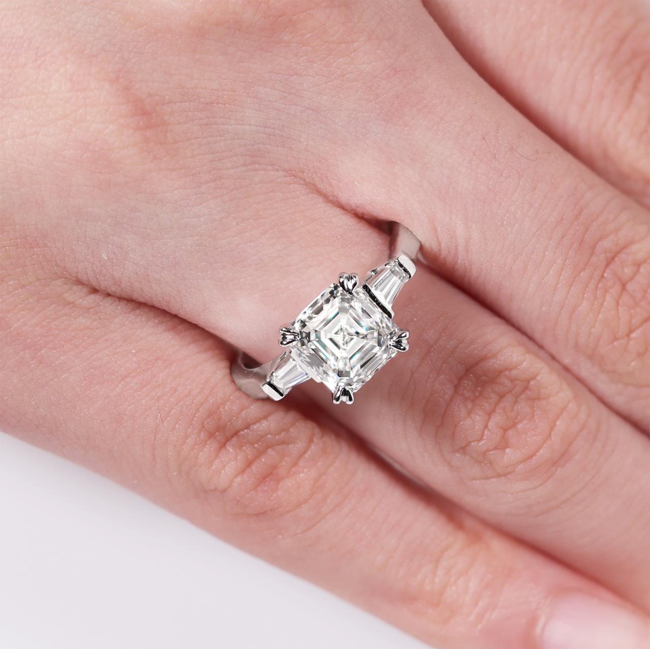 18ct white gold Asscher cut diamond engagement ring with tapered baguettes. GIA Cert
