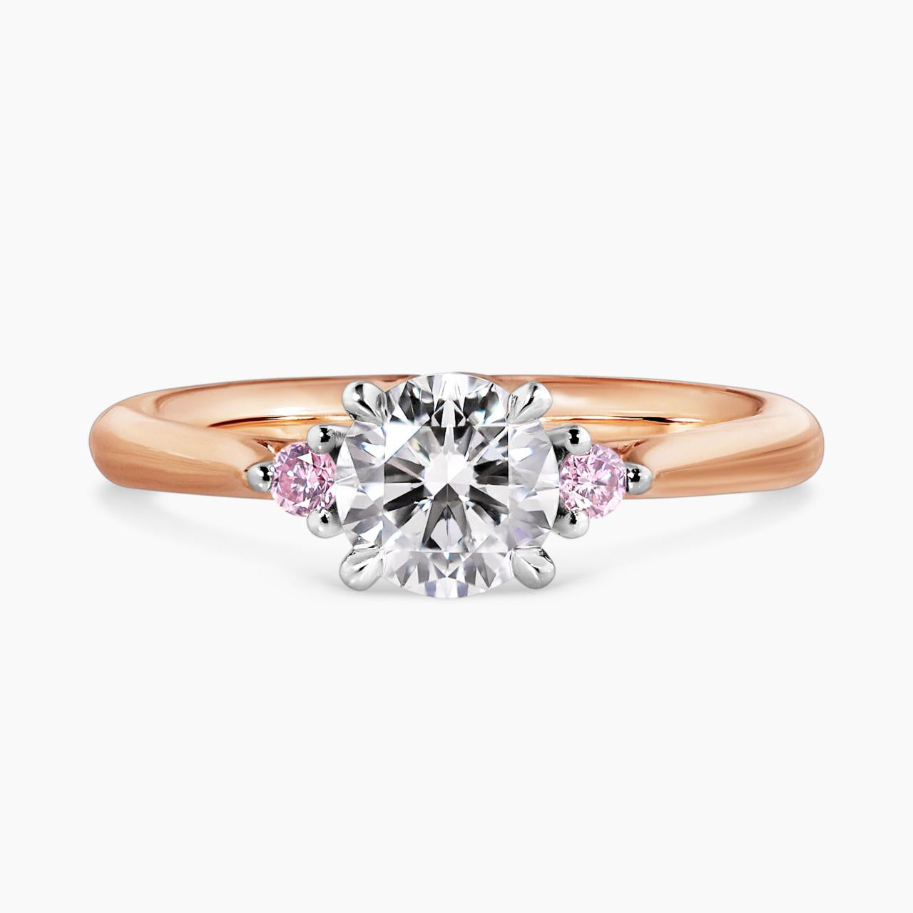 18ct white and rose gold round brilliant cut diamond engagement ring with round pink diamonds on either side. GIA Cert