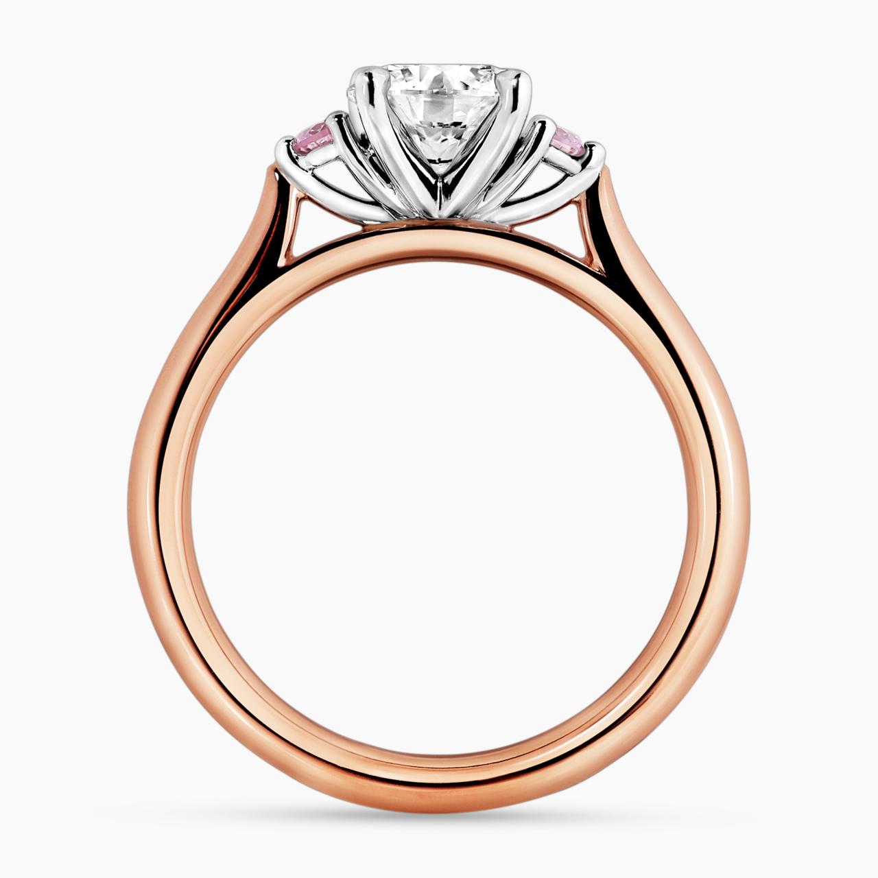 18ct white and rose gold round brilliant cut diamond engagement ring with round pink diamonds on either side. GIA Cert
