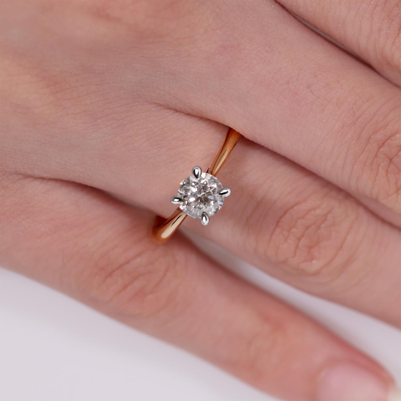 18ct rose and white gold round brilliant cut diamond engagement ring with hidden halo. GIA Cert