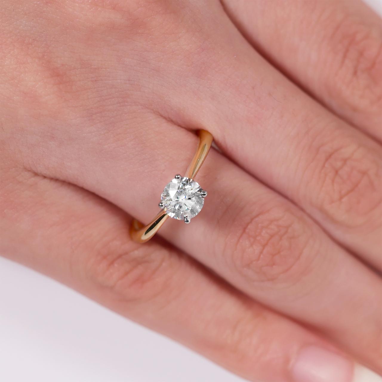 PUGLIA - 18ct rose gold round brilliant cut diamond solitaire engagement ring in a four claw setting with hidden halo. GIA Cert
