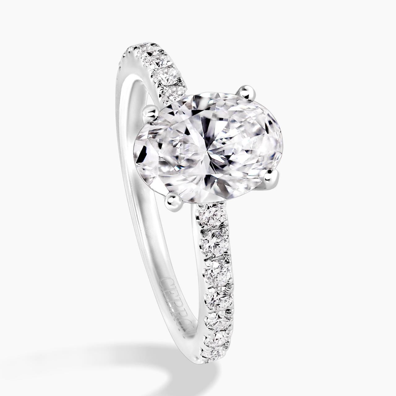 18ct white gold oval cut diamond engagement ring in a four claw setting with a diamond band. GIA Cert
