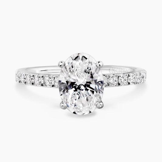 18ct white gold oval cut diamond engagement ring in a four claw setting with a diamond band