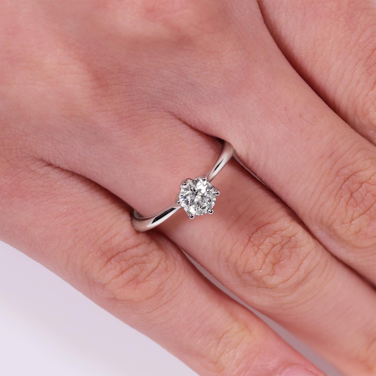 18ct white gold round brilliant cut diamond solitaire ring in a six claw setting. GIA Cert
