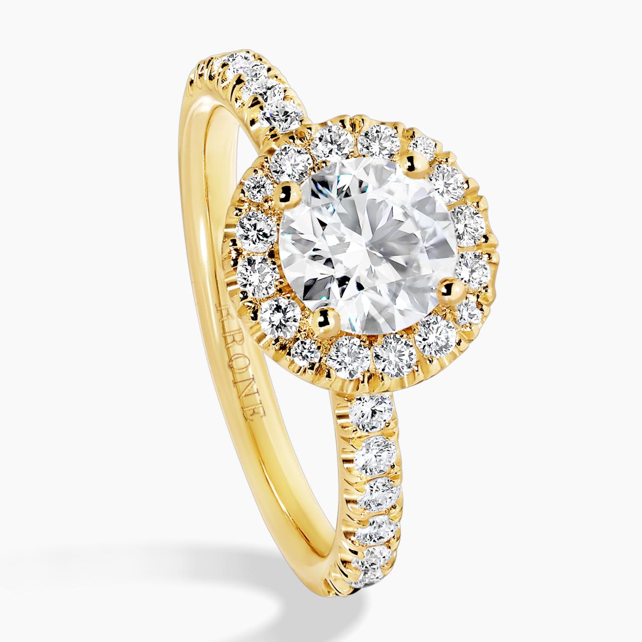 18ct yellow gold round brilliant cut diamond ring with halo. GIA Cert
