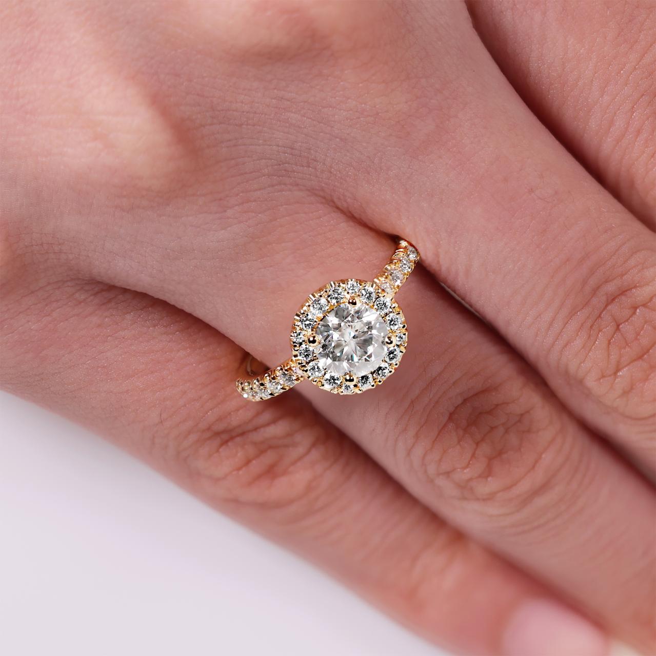 18ct yellow gold round brilliant cut diamond ring with halo. GIA Cert