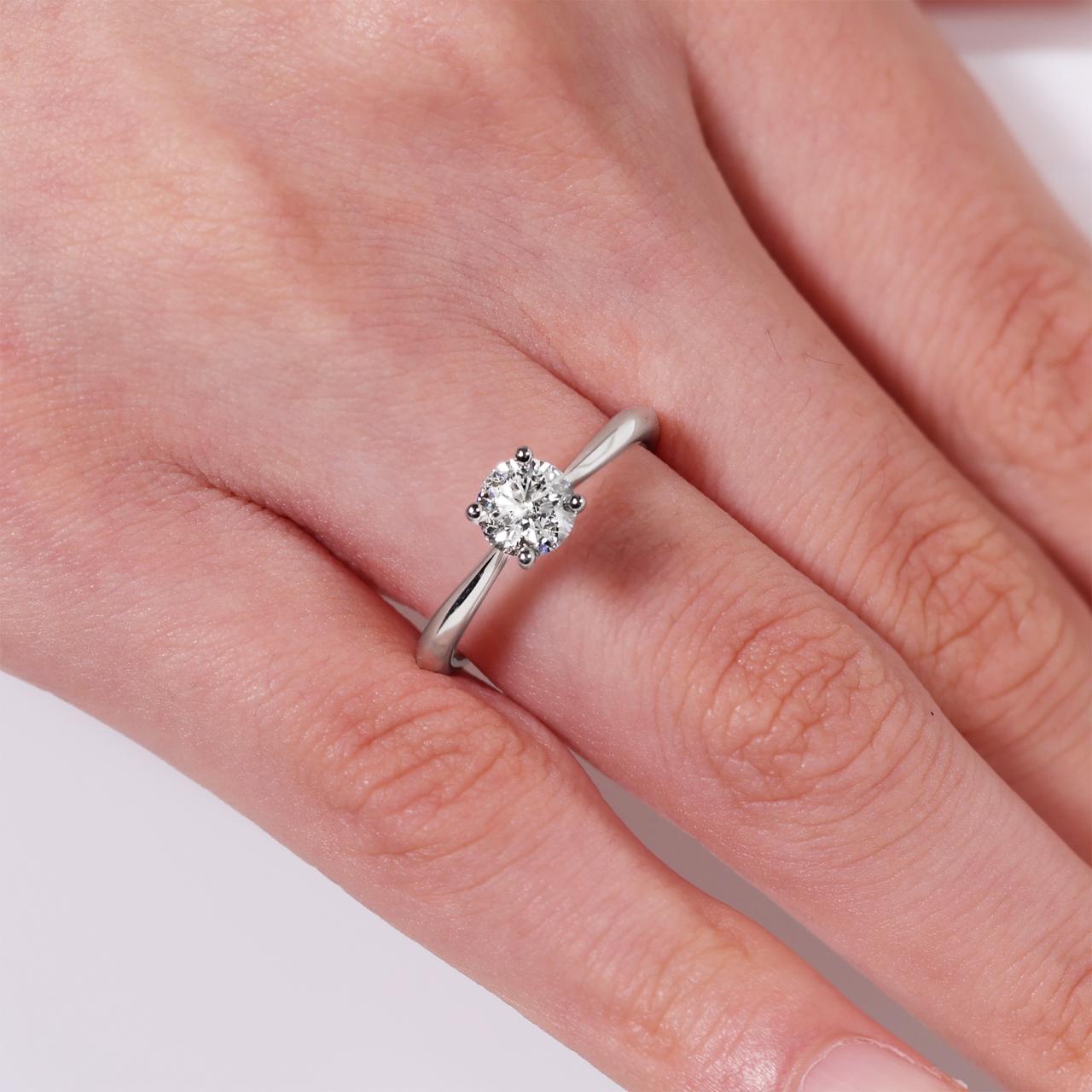 18ct white gold round brilliant cut diamond solitaire engagement ring in a four claw setting. GIA Cert