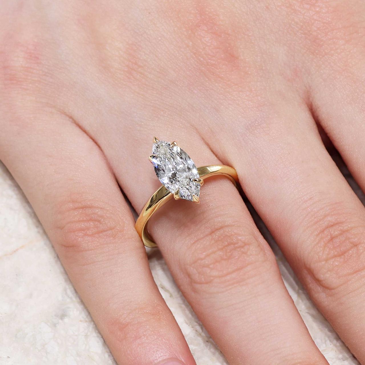18ct yellow gold 2.06ct E VVS2 marquise Lab grown diamond solitaire ring in a six claw setting. IGI Cert