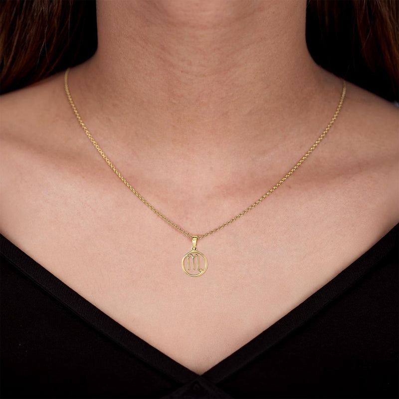 18ct yellow gold Scorpio zodiac pendant on the neck