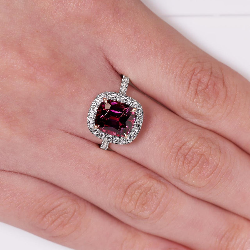 18ct white and rose gold 4.19ct cushion cut Rhodolite and diamond ring on the finger