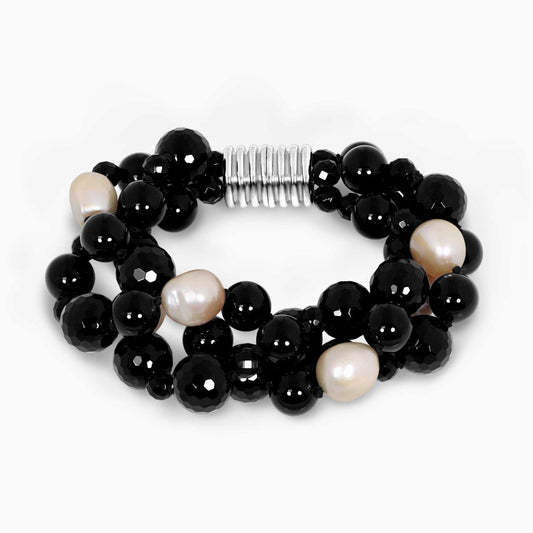 Three rows of apricot fresh water pearl and onyx beads bracelet ended with a silver ribbed magnetic clasp 