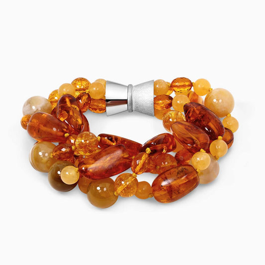 Four rows of mixed amber, yellow agate, yellow crystal and orange calcite beads bracelet ended with a silver magnetic clasp 