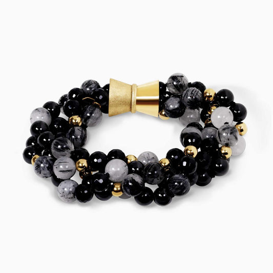Four rows of black rutile, black tourmaline, onyx and gold plated hemitite beads bracelet ended with a gold plated silver magnetic clasp from the Carmela Cerrone Collection