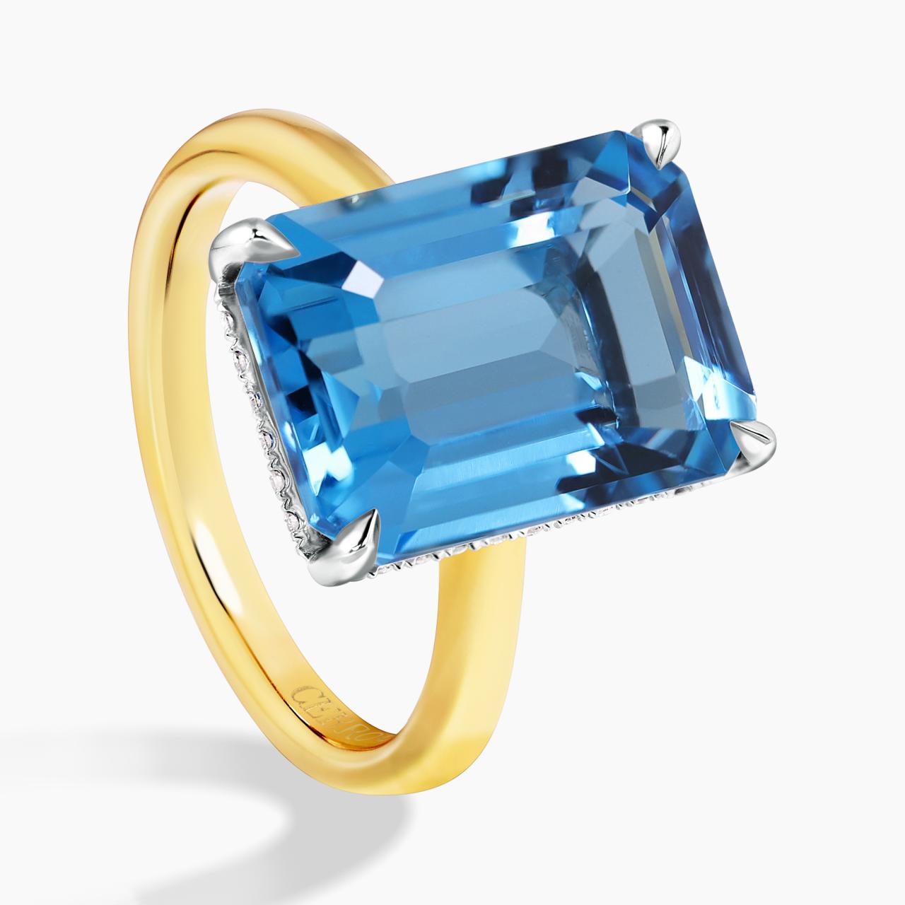 18ct yellow and white gold 8.48ct emerald shape step cut Swiss blue topaz and diamond ring