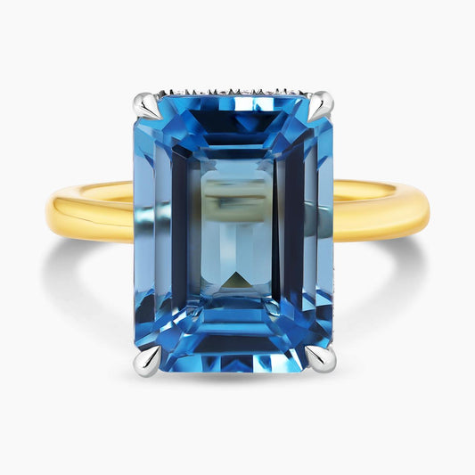 18ct yellow and white gold emerald shape step cut Swiss blue topaz and diamond ring