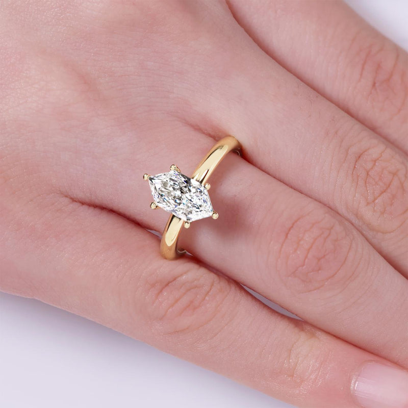 18ct yellow gold 1.59ct D VVS2 Lab grown hexagonal diamond solitaire engagement ring in a six claw setting on the finger
