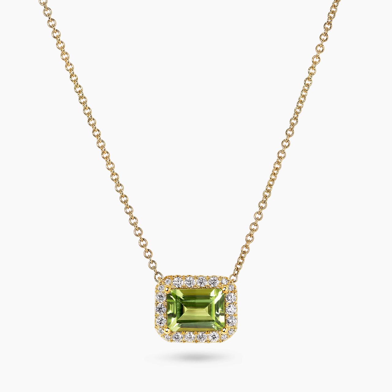 18ct yellow gold 1.55ct emerald cut peridot and diamond necklace in a four claw setting