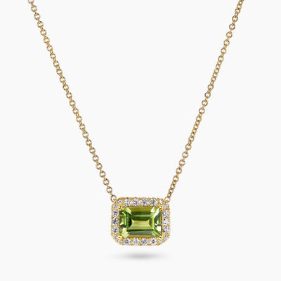 18ct yellow gold 1.55ct emerald cut peridot and diamond necklace in a four claw setting