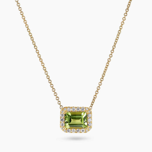 18ct yellow gold 1.55ct emerald cut peridot and diamond necklace in a four claw setting