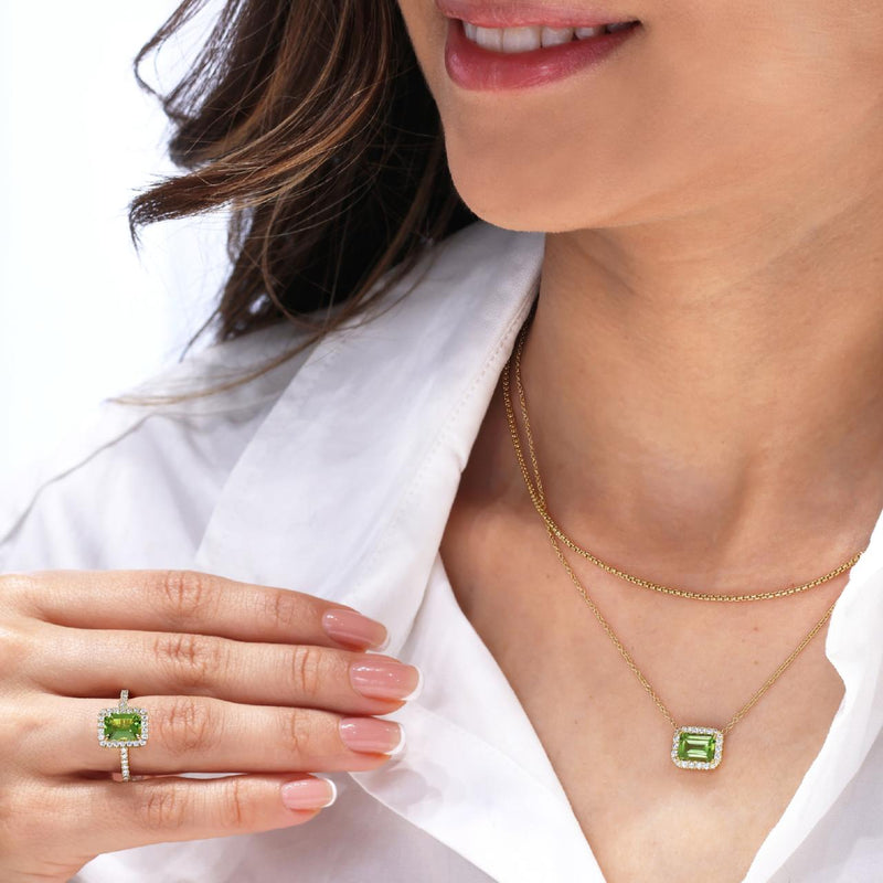 18ct yellow gold 1.55ct emerald cut peridot and diamond necklace in a four claw setting on the neck