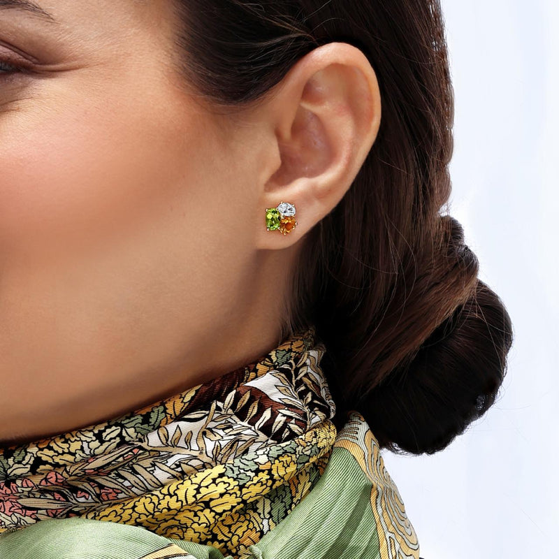 18ct white gold Oval Peridot, Heart Citrines and Oval Diamond stud earrings on the ear