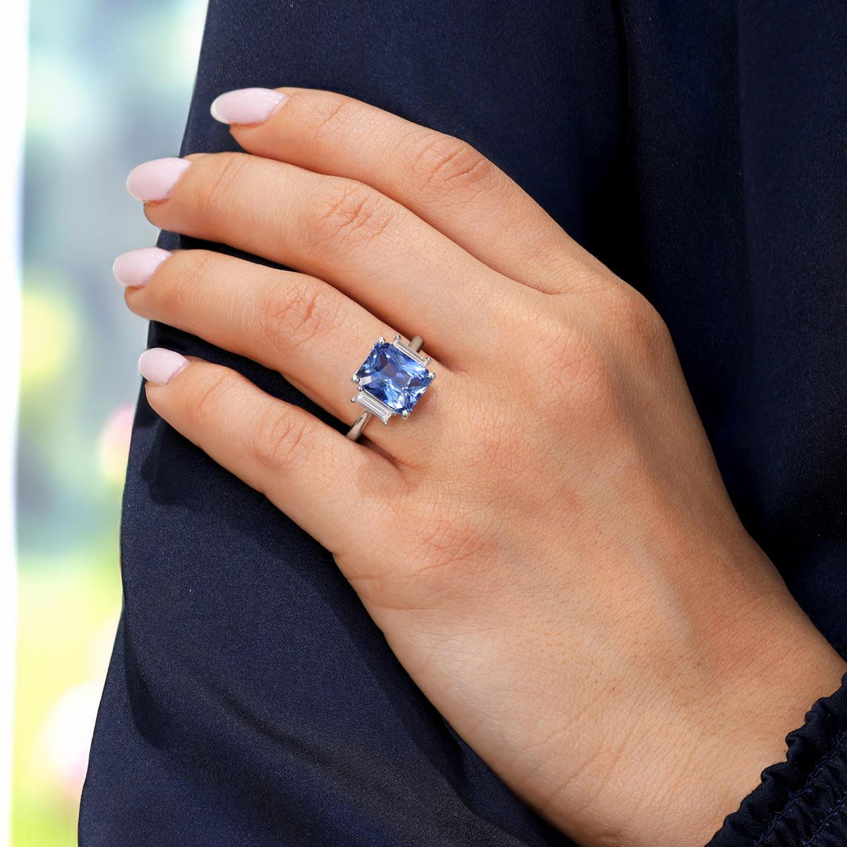 18ct white gold 5.58ct emerald cut Ceylon sapphire and baguette and round cut diamonds ring
