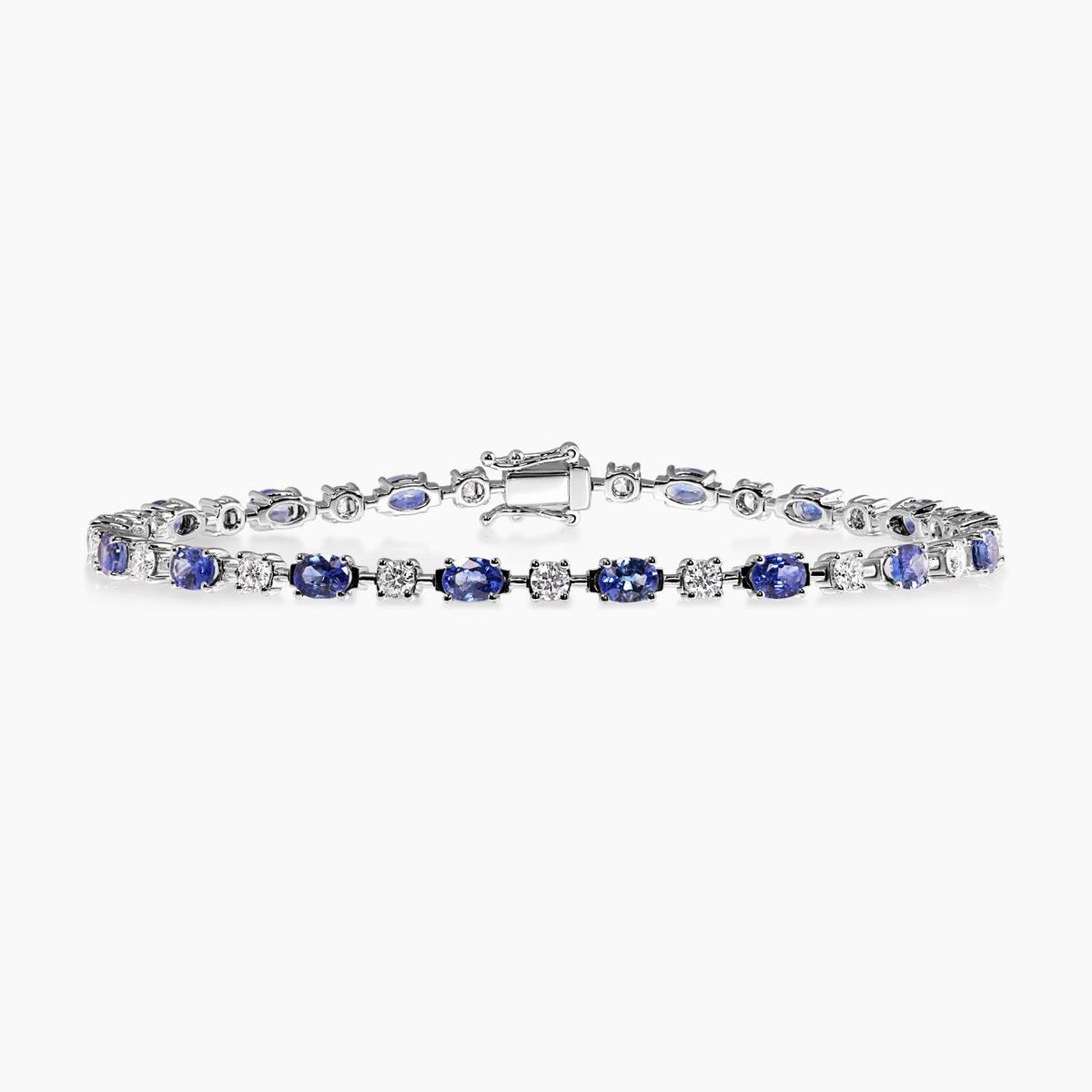 18ct white gold oval Ceylon sapphires and round brilliant cut diamonds tennis bracelet in a four claw setting