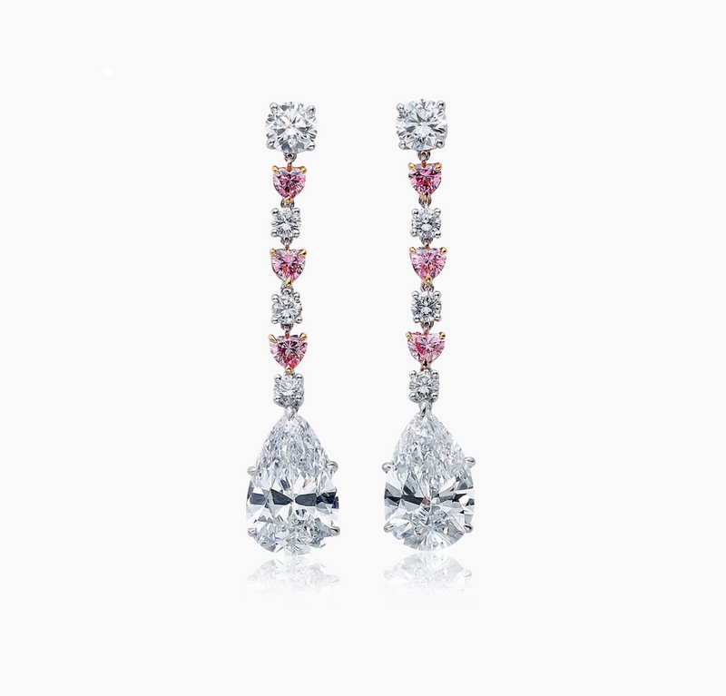 A pair of 18ct white and rose gold drop earrings featuring pear, heart, and round brilliant cut pink and white diamonds.