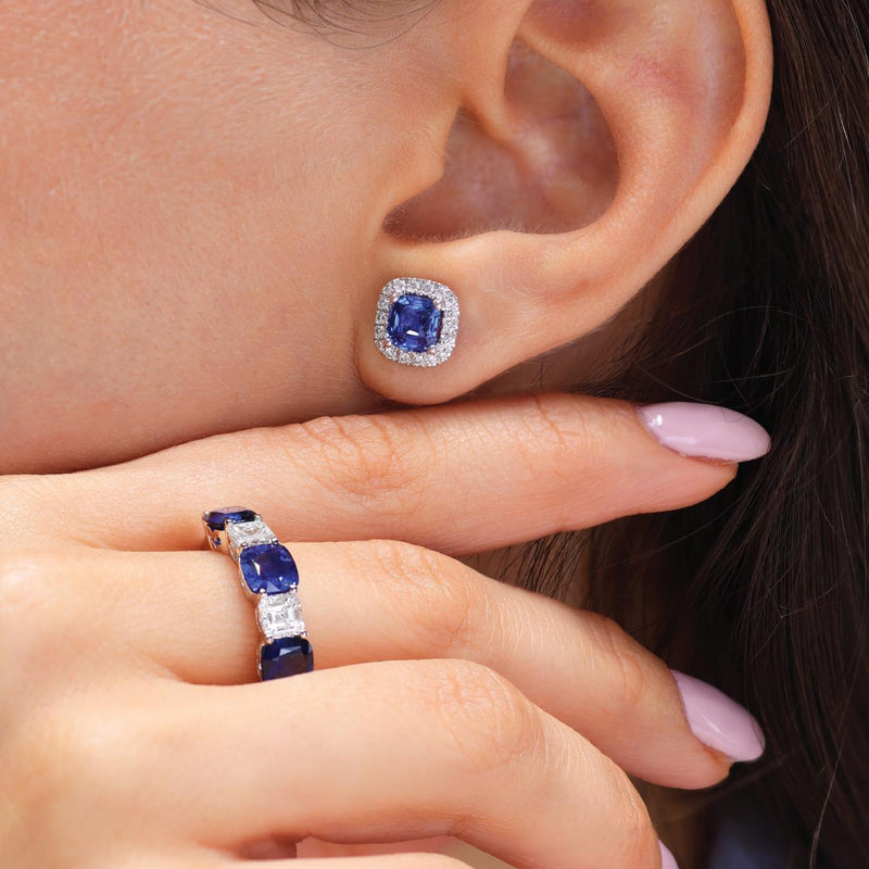 18ct white gold cushion shape blue sapphires & Asscher diamonds ring on the finger