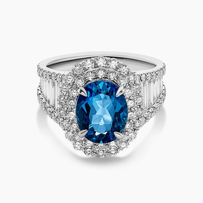 Platinum oval London blue topaz, baguette and round brilliant cut diamond double halo ring