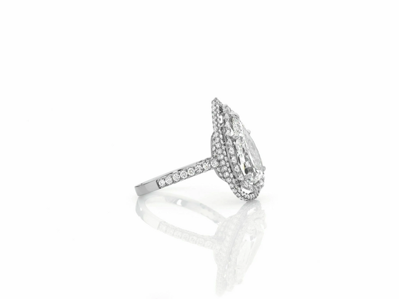 Platinum 3.01ct pear and round brilliant cut double halo pave set ring side profile