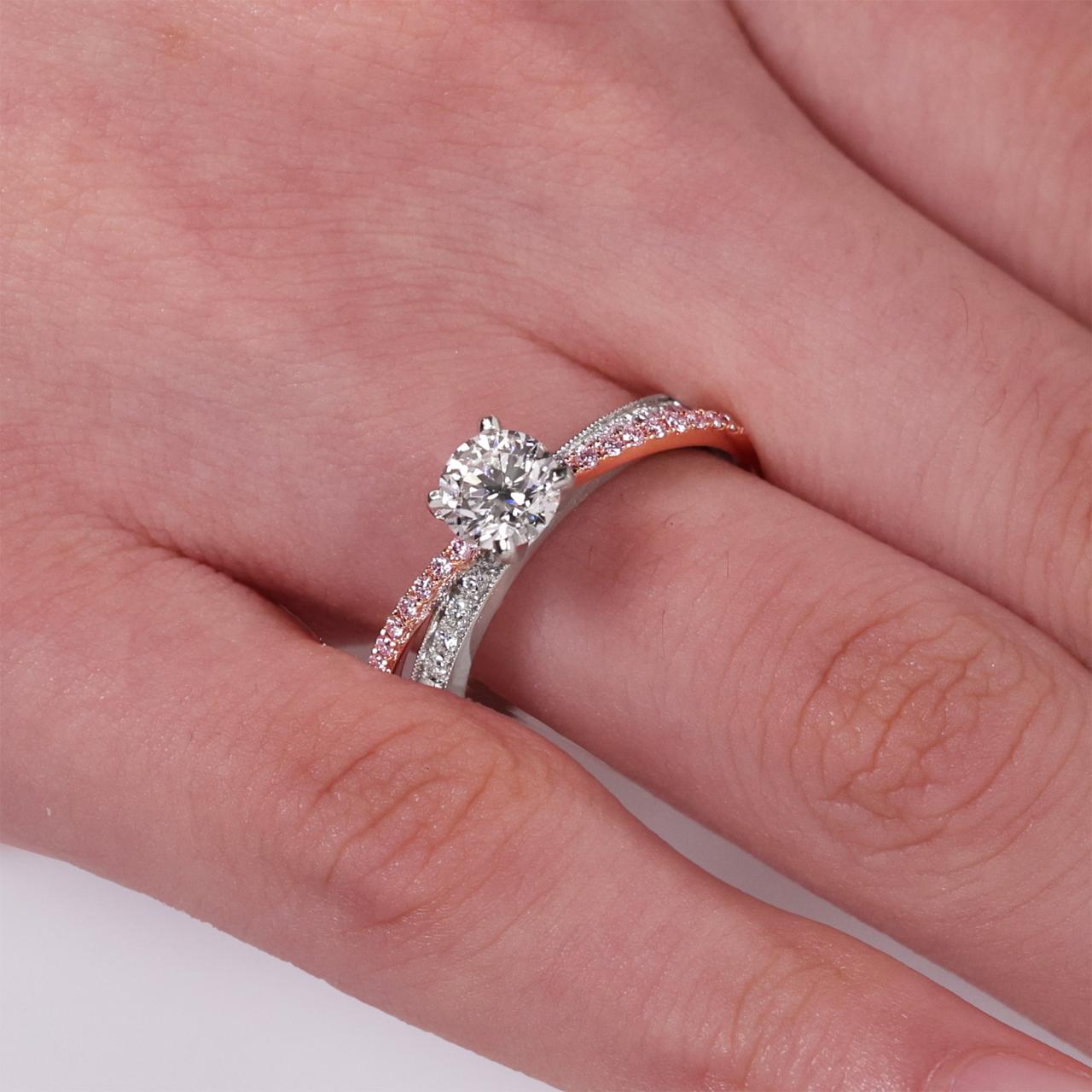 18ct White and Rose Gold 0.75ct Round Brilliant cut Diamond Ring with pink and white round diamonds on the band