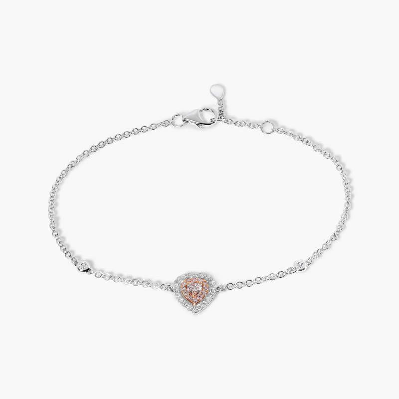 An 18ct white and rose gold bracelet featuring a heart-shaped design with pink and white diamonds.