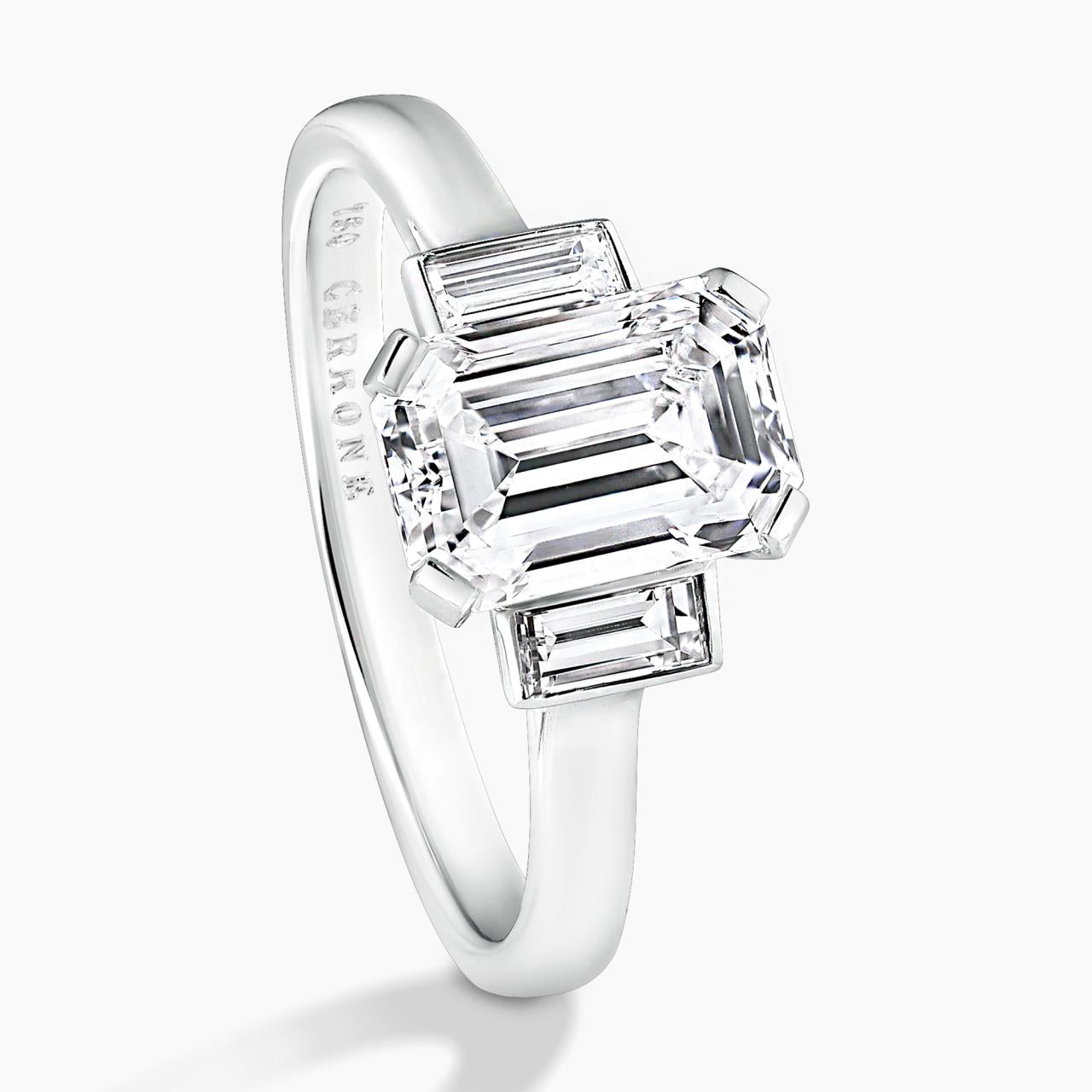 Platinum 1.81ct emerald cut diamond ring with baguette diamonds in bezel setting on the side