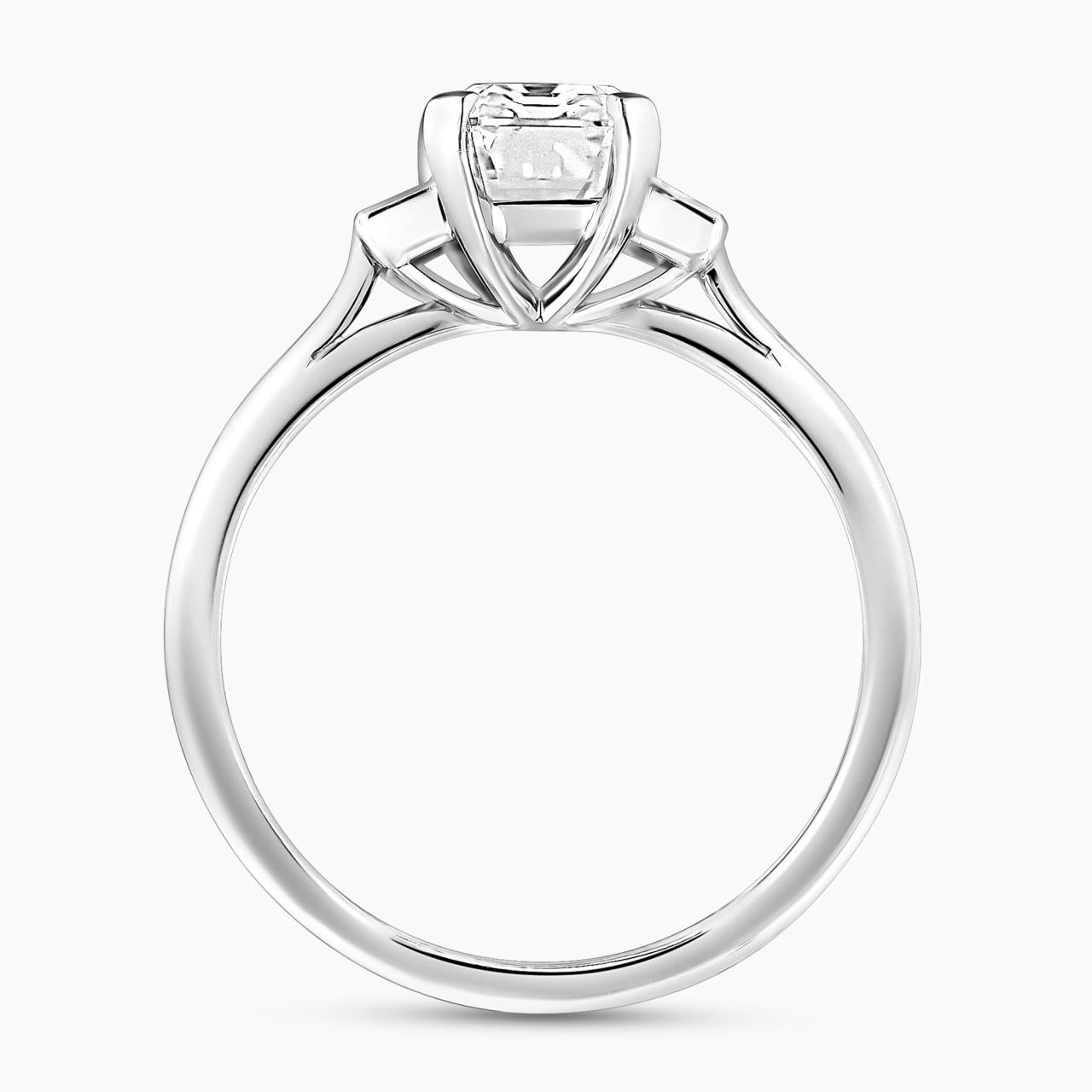 Platinum 1.81ct emerald cut diamond ring with baguette diamonds in bezel setting on the side