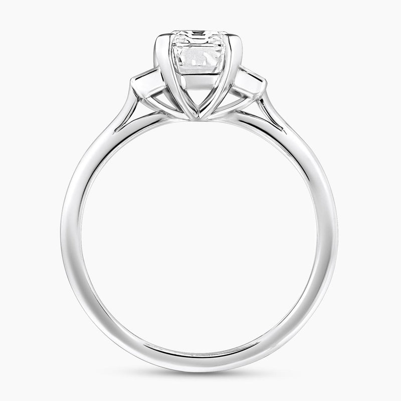 Platinum 1.81ct emerald cut diamond ring with baguette diamonds in bezel setting on the side